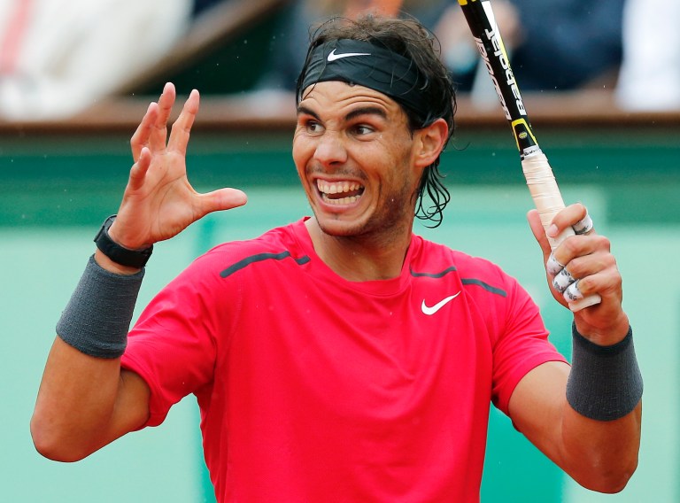   Spain's Rafael Nadal reatcs as he plays Serbia's Novak Djokovic during their men's final match in the French Open tennis tournament at the Roland Garros stadium in Paris, Sunday, June 10, 2012. (AP Photo/Michel Euler)  