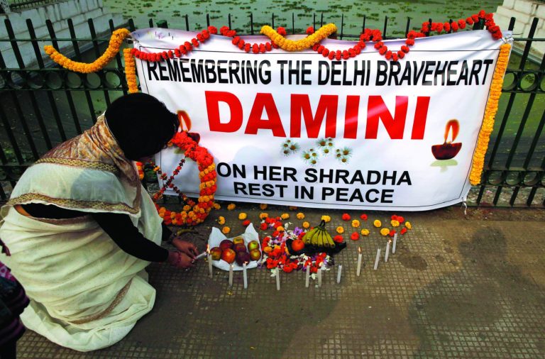 An India woman lights candles in Gauhati, India, Thursday, Jan. 10, 2013 in remembrance of a young woman who was gang- raped on a moving bus in New Delhi. The case has sparked protests across India by women and men who say India's legal system doesn't do enough to prevent attacks on women. (AP Photo/Anupam Nath)