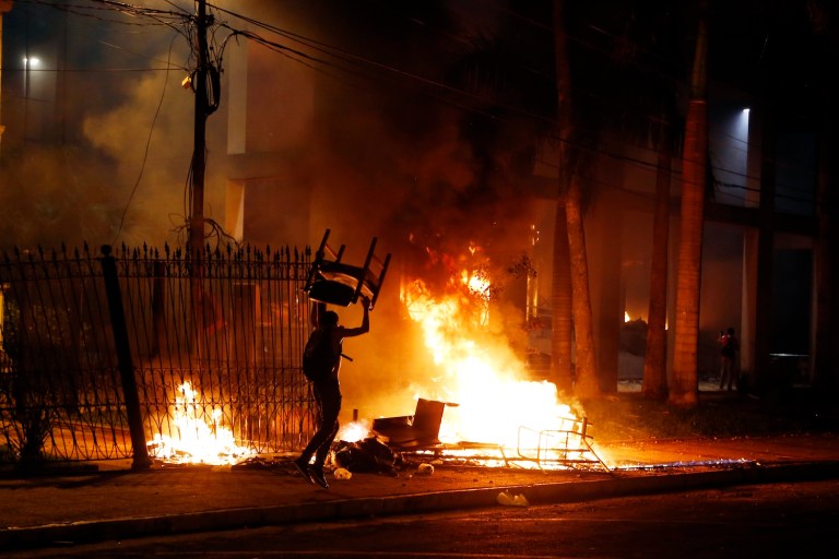 The riots were in response to the parliament passing a bill that would lift presidential term limits. (AP Photo/Jorge Saenz)