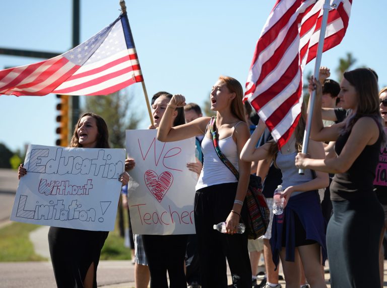 Student walk-outs in Jefferson County continued for the third straight day as students from Chatfield High School and Dakota Ridge High School protest Thursday, Sept. 24, 2014, in Littleton, Colo. The students are protesting a proposal by the Jefferson County School Board to emphasize patriotism and downplay civil unrest in the teaching of U.S. history. (AP Photo/The Denver Post, RJ Sangosti)