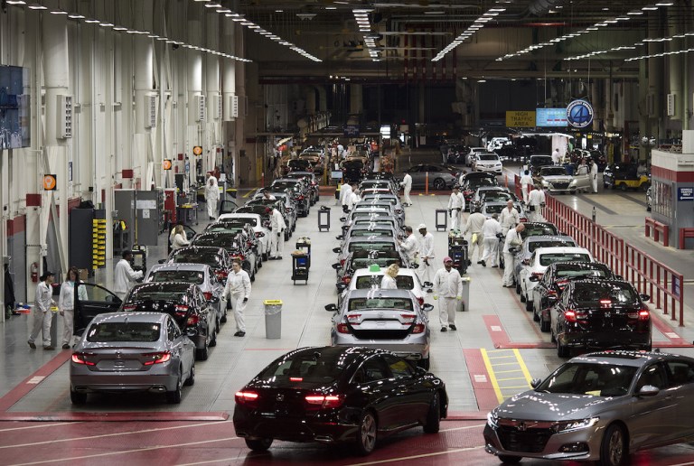 Employees look over 2018 Honda Accord vehicles on the customer preparation line at the Honda of America Manufacturing Inc. Marysville Auto Plant in Marysville, Ohio, U.S., on Thursday, Dec. 21, 2017. More than three decades afterÂ Honda Motor Co.Â first built an Accord sedan at its Marysville factory in 1982, humans are still an integral part of the assembly process -- and that's unlikely to change anytime soon. 