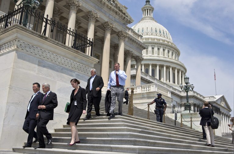   FILE - In this Friday, Aug. 2, 2013, file photo, members of Congress walk down the steps of the House of Representatives on Capitol Hill in Washington. The Treasury reports on the budget deficit for August on Thursday, Sept. 12, 2013. (AP Photo/J. Scott Applewhite, File)  