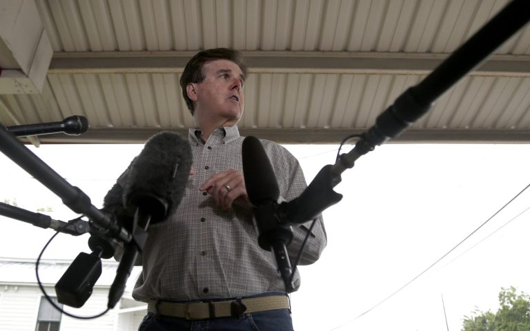Republican Dan Patrick faces the media at a polling place on election day Tuesday, May 27, 2014, in Houston. Patrick has been in a bitter Republican primary runoff for lieutenant governor against David Dewhurst who has held the post for 12 years. (AP Photo/Pat Sullivan)