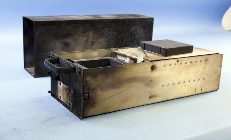 This photo released Tuesday, June 3, 2014, by the National Transportation Safety Board in Washington, shows the flight data recorder, also known as a black box, recovered from the private jet destroyed in a fiery crash Saturday night at Hanscom Field in Bedford, Mass. Philadelphia Inquirer co-owner Lewis Katz and six others were killed in the crash. (AP Photo/National Transportation Safety Board)