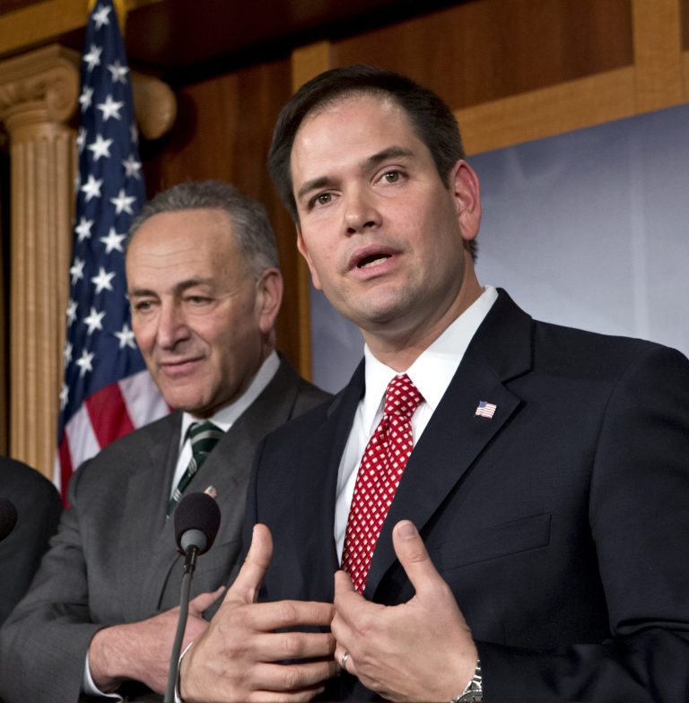 AP file 
The immigration bill sponsored by Sen. Charles Schumer, D-N.Y., left, and Sen. Marco Rubio, R-Fla., would create a financial incentive for some employers to hire newly amnestied immigrants over Americans.