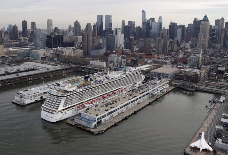 FILE - In a Dec. 1, 2013 aerial file photo, the cruise ship Norwegian Breakaway is berthed on the westside of Manhattan in New York. Norwegian Cruise Line is getting into the luxury cruise business by acquiring Prestige Cruises International in a deal worth about $3 billion. Shares of Norwegian jumped more than 14 percent before the opening bell Tuesday, Sept. 2, 2014. (AP Photo/Mark Lennihan)