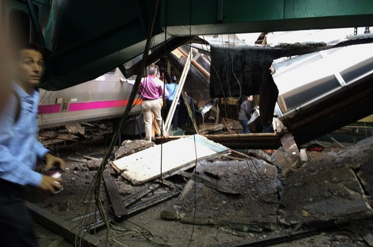 A Thursday morning commuter train crashed at a high speed into a Hoboken train station, killing at least 1 and injuring 74 others. (William Sun via AP)