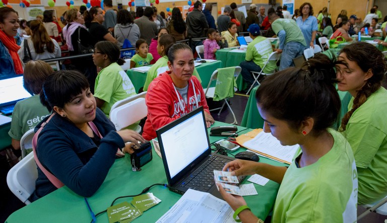 A surge of sign-ups is expected during the final days of open enrollment. Further, people who don't change their health plan, renew it themselves or cancel it will be automatically placed into a similar plan. (David Paul Morris/Bloomberg)