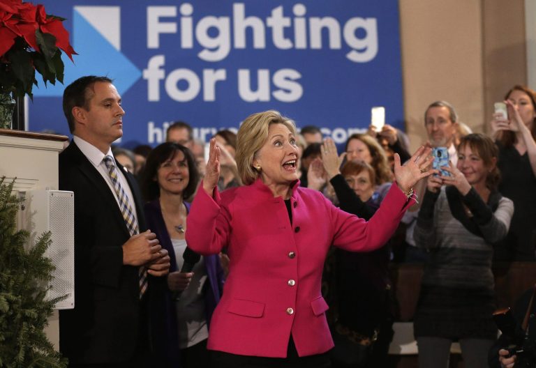In a new ad, Hillary Clinton pledges to oppose the conservative agenda of Iowa Gov. Terry Branstad and her would-be rivals in next year's presidential race. (AP Photo)
