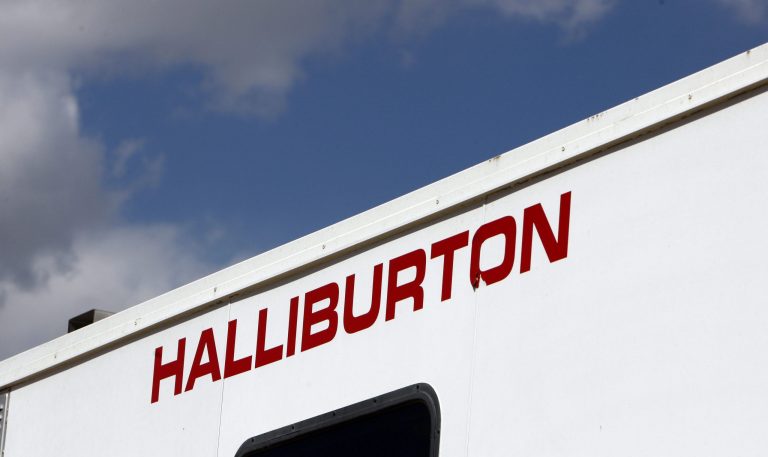 FILE - In this April 15, 2009 file photo, the Halliburton sign adorns the side of a machine being used by the company at a site in Rulison, Colo. The Supreme Court appears open to the idea of modifying a quarter century of precedent to make it harder for investors to join together to sue corporations for securities fraud. The justices heard arguments Wednesday in an appeal by Halliburton Co. that seeks to block a class-action lawsuit claiming the energy services company inflated its stock price. (AP Photo/David Zalubowski, File)