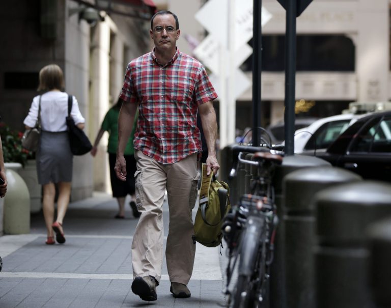 In this July 22, 2014 photo, AIDS activist Gregg Gonsalves walks outside Grand Central Terminal during a photo session, in New York. In the early 1990s, Gonsalves traveled to Washington to confront, provoke and challenge officials at the Food and Drug Administration. A quarter century later, he still travels to Washington, but with a very different agenda: to defend the FDA. (AP Photo/Richard Drew)