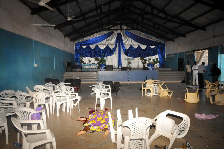 The body  of the a worshipper lies on the floor inside Kenyan Joyland church in Likoni,  near Mombasa, Kenya Sunday, March 23, 2014. Kenyan officials said  three people died after gunmen opened fire in a church just outside the coastal city of Mombasa. The Interior Ministry said Sunday that three gunmen opened fire inside the Joyland Church killing a small number of  people. At least 10  were wounded.  (AP Photo)