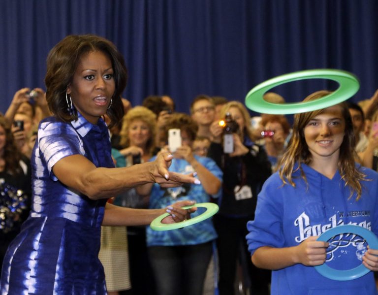 First Lady Michelle Obama partakes in an event at Watertown High School to encourage people to drink more water, Thursday, Sept. 12, 2013, in Watertown, Wis. (AP Photo/Morry Gash)