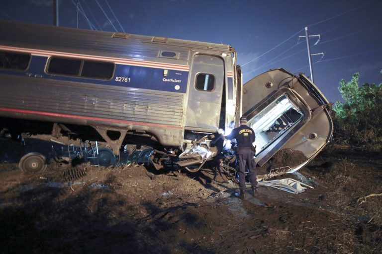 Emergency personnel work the scene of a deadly train wreckÂ onÂ May 12 in Philadelphia. An Amtrak train headed to New York City derailed, killing eight people and injuring 200 passengers and crew. (AP Photo)
