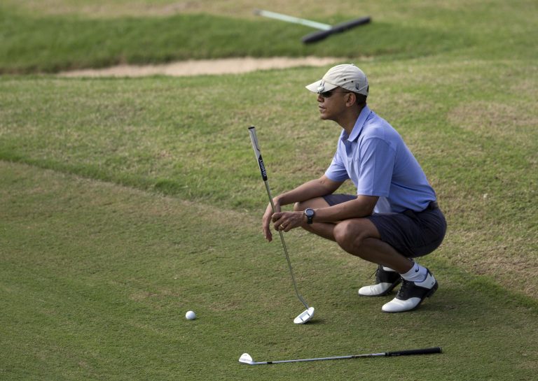 U.S. President Barack Obama golfs at Mid-Pacific County Club in Kailua, Hawaii, Monday, Dec. 23, 2013. The first family is in Hawaii for their annual holiday vacation. (AP Photo/Carolyn Kaster)