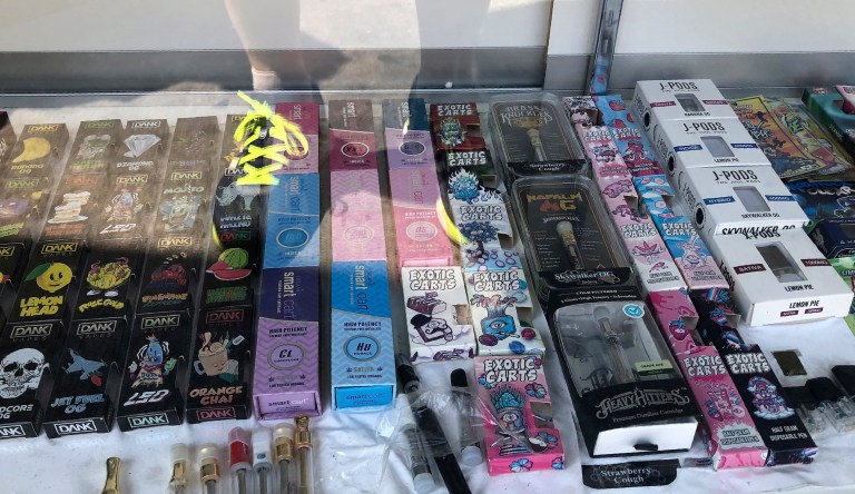 Boxes of vaping products labeled with the Dank name, seen left, for sale at a retail vaping store downtown Los Angeles. A shadowy but widely sold illegal marijuana vape is drawing the attention of investigators looking into a rash of mysterious lung illnesses around the country. Investigators have not identified a culprit in the outbreak but say patients have frequently mentioned using Dank Vapes. (AP Photo/Michael R. Blood)