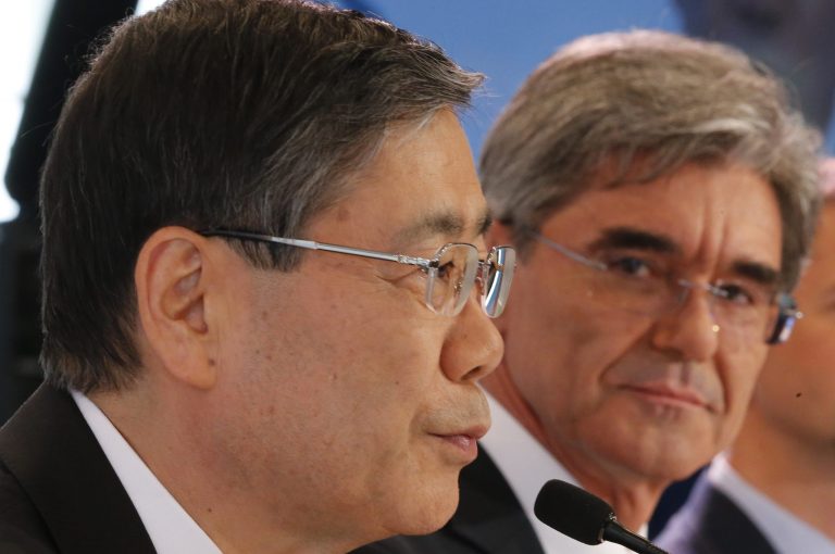 Siemens CEO Joe Kaeser, right, and Mitsubishi CEO Shunichi Miyanaga, meet with media, after their Mitsubishi Heavy Industries meeting with French President Francois Hollande, to discuss their offer to buy parts French engineering company Alstom SA, in Paris, Tuesday, June 17, 2014. Joe Kaeser, CEO of Alstom's German rival Siemens AG, and Shunichi Miyanaga, CEO of Mitsubishi, were at the Elysee palace in Paris hours after they unveiled their offer to buy parts of Alstom. Siemens would pay 3.9 billion euros for the gas turbine business. Japan's Mitsubishi would purchase a 10 percent stake in Alstom and inject 3.1 billion euros into the struggling company. (AP Photo/Jacques Brinon)