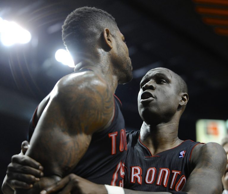   Toronto Raptors' Mickael Pietrus, right, calms teammate Amir Johnson after he was ejected during the third quarter of an NBA basketball game against the Portland Trail Blazers in Portland, Ore., Monday, Dec. 10, 2012. The Trail Blazers beat the Raptors 92-74. (AP Photo/Greg Wahl-Stephens)  