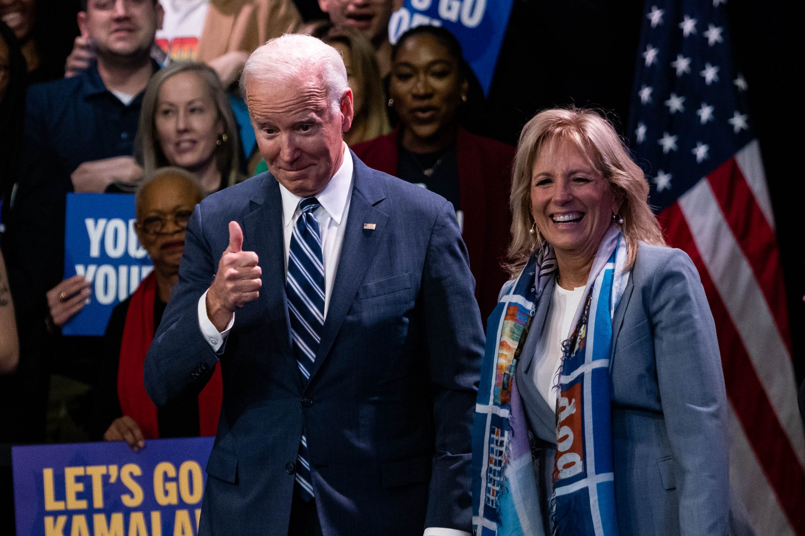 US President Joe Biden, alongside First Lady Jill Biden,  gives a thumbs up a Democratic National Committee (DNC) rally at Howard Theater in Washington, DC, Thursday, November 10, 2022. Biden said his economic plan is showing results, citing promising data on inflation, two days after Democrats lodged a better-than-predicted showing in midterm elections.