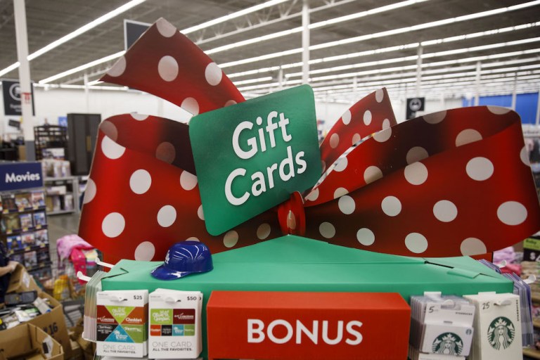 A gift card display stands at a Walmart Inc. store in Burbank, California, U.S., on Monday, Nov. 19, 2018. To get the jump on Black Friday selling, retailers are launching Black Friday-like promotions in the weeks prior to the event since competition and price transparency are forcing retailers to grab as much share of the consumers' wallet as they can. 