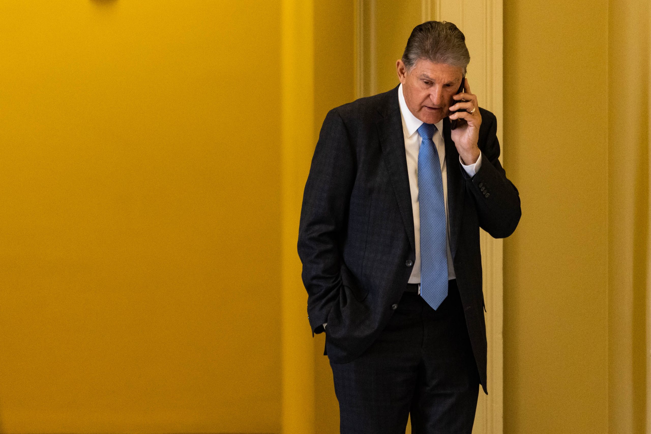 Senator Joe Manchin, D-WV, takes a phone call outside a Senate Democratic luncheon, on Capitol Hill, Tuesday, November 29, 2022. Manchin is expecting a rough reelection in 2024 as Congressman Alex Mooney announced earlier this month he would be making a bid against Manchin.