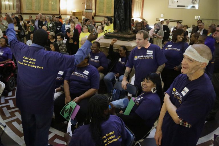 Service Employees International Union members rally in the capitol rotunda before a Senate hearing on pension legislation at the state Capitol in Springfield Ill. (AP/Seth Perlman)