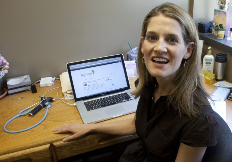   In this Friday, June 8, 2012 photo, Dr. Natasha Burgert talks about using social media in her practice at her office in Kansas City, Mo. There's a stereotype that says doctors shun technology that might threaten patients' privacy and their own pocketbooks. But a new breed of physicians is texting health messages to patients, tracking disease trends on Twitter, identifying medical problems on Facebook pages and communicating with patients through email. (AP Photo/Orlin Wagner)  