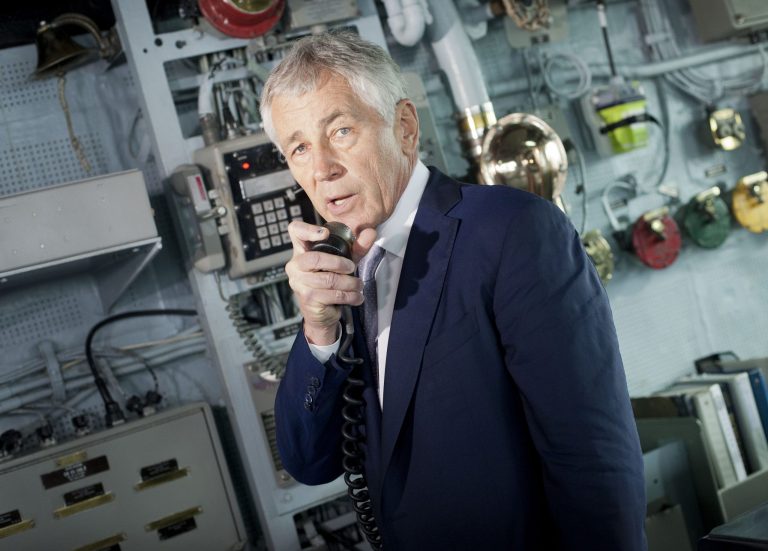 Defense Secretary Chuck Hagel uses the internal communication systems as he addresses the crew of the USS Vella Gulf during his tour in Constanta, Romania, Thursday, June 5, 2014. (AP Photo/Pablo Martinez Monsivais, Pool)