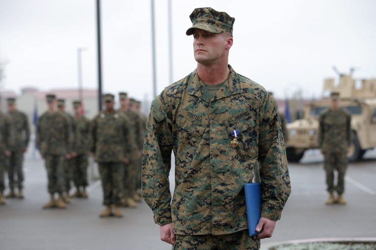   U.S. Marine Sgt. William Soutra Jr. wears the Navy Cross during a ceremony held at Camp Pendleton, Calif., Monday, Dec. 3, 2012. Soutra Jr. was awarded the medal for his heroism while serving in Afghanistan. (AP Photo/Jae C. Hong)  