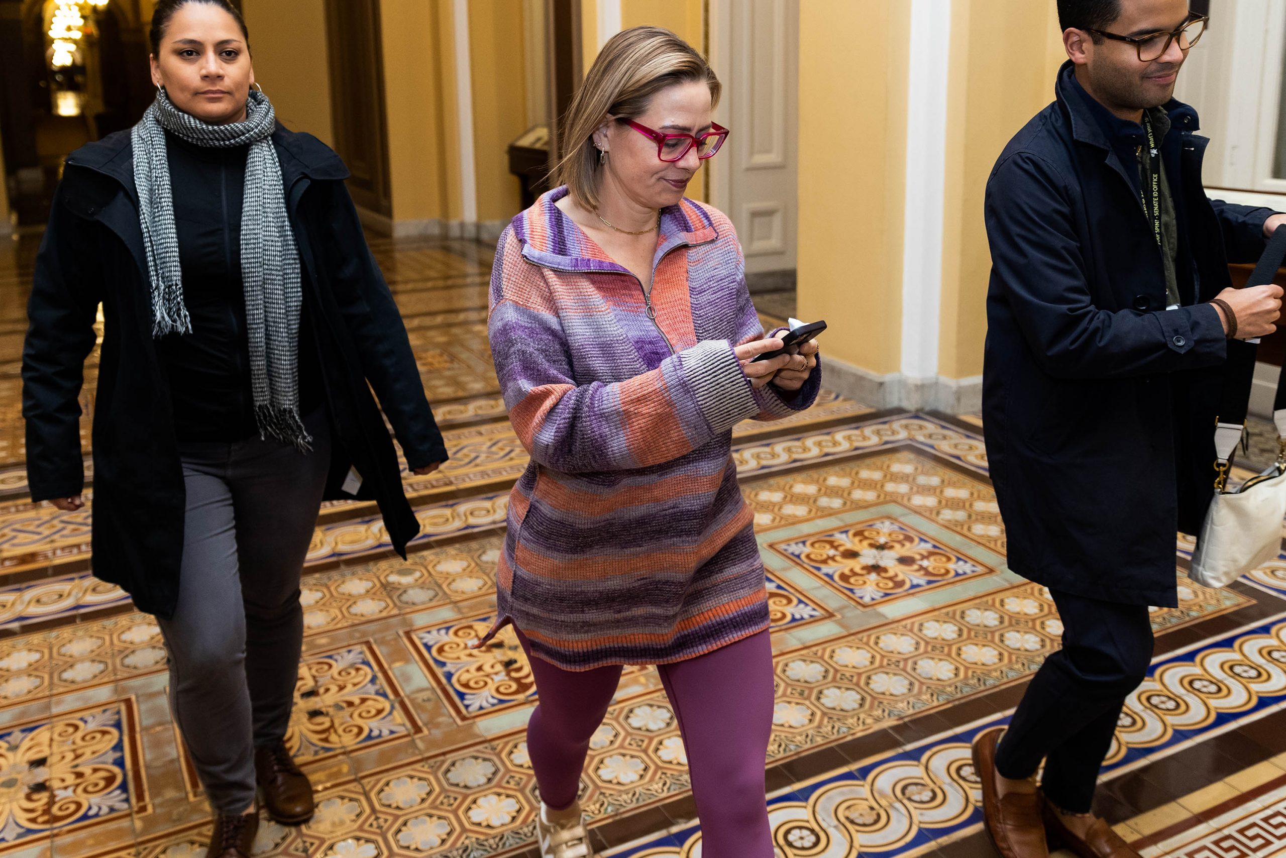 Sen. Kyrsten Sinema walks to the Senate floor to vote, on Monday, December 12, 2022. Sinema announced this week that she would be leaving the Democratic Party and registering as an independent.