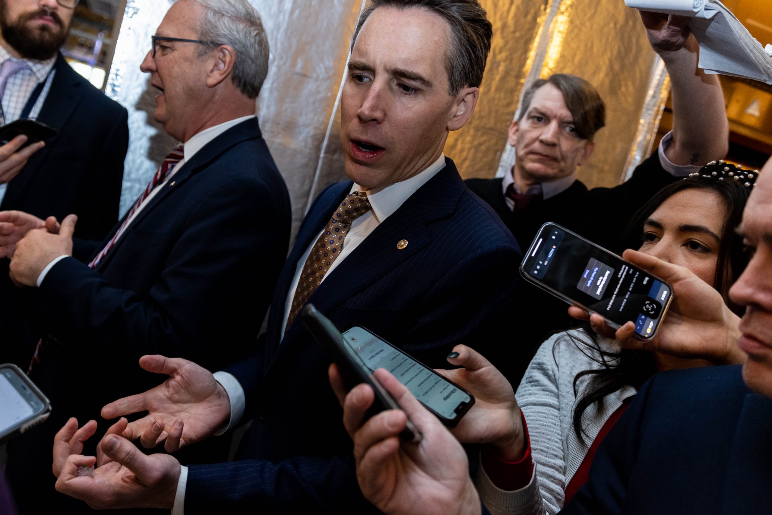 Sen. Josh Hawley takes questions from reporters on Capitol Hill, Thursday, December 15, 2022, Hawley introduced the 'No TikTok on Government Devices Act,' which the Senate unanimously approved legislation banning the use of TikTok on government phones and devices as part of the push to combat security concerns related to the Chinese-owned social media company.