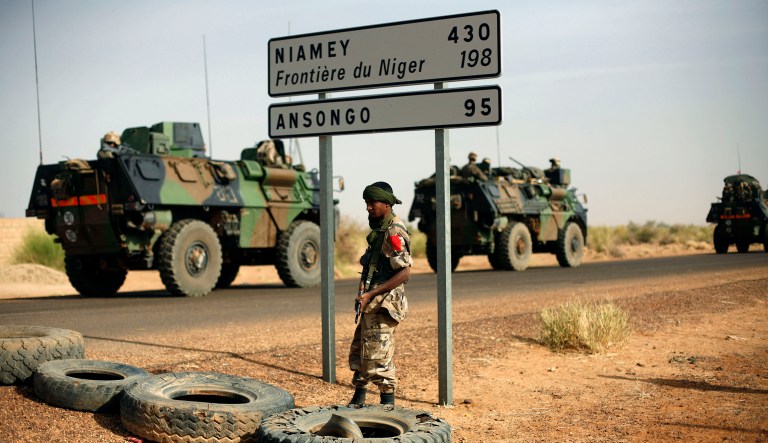 FILE - This Feb. 6, 2013, file photo shows French armoured vehicles heading towards the Niger border before making a left turn north in Gao, northern Mali. American and French forces have spent years providing training and support to the militaries of Mali, Niger and other vulnerable countries in this corner of Africa where Islamic extremism has become entrenched over the past decade. (AP Photo/Jerome Delay, File)