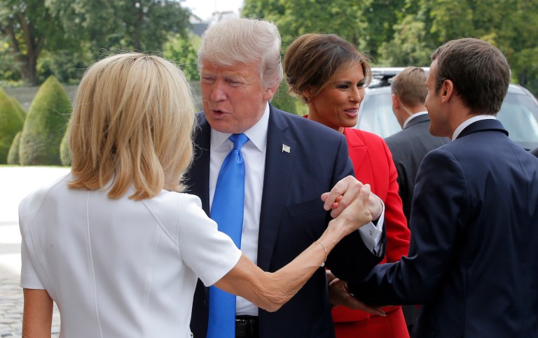 Trump makes uncomfortable compliments to an allied leader's wife. (AP Photo/Michel Euler)