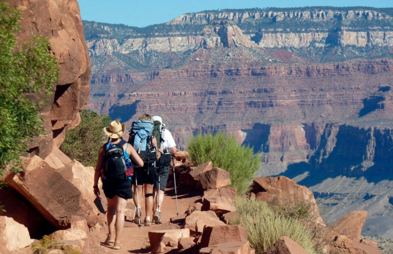 FILE - This Monday, Sept. 27, 2010, file photo, shows hikers on the South Kaibab Trail in Grand Canyon National Park, Ariz. One of the most lucrative contracts in the National Park Service is going out to bid for a third time, after Grand Canyon found the previous bids unacceptable. The successful bidder will provide lodging, food, retail and transportation services as well as mule rides on the South Rim. Those services are expected to bring in nearly $1 billion in gross revenue over 15 years. (AP Photo/Carson Walker, File)