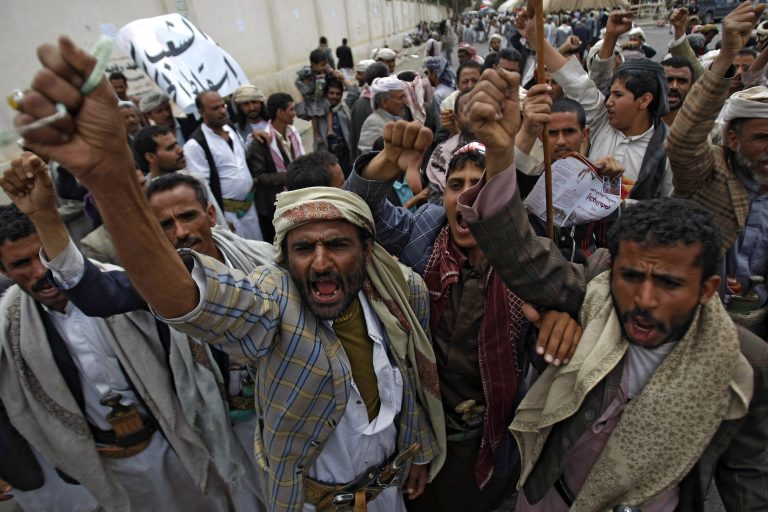 Yemeni Shiite Hawthi rebels chant slogans demanding the government step down during a demonstration in a street leading to the  Interior Ministry in Sanaa, Yemen, Saturday, Aug. 23, 2014. Thousands of supporters of the Hawthi group, a powerful Yemeni Shiite rebel group, escalated their standoff with the government on Friday, setting up tents near three ministries to press for the replacement of Prime Minister Mohammed Salem Bassindwa who they depict as 