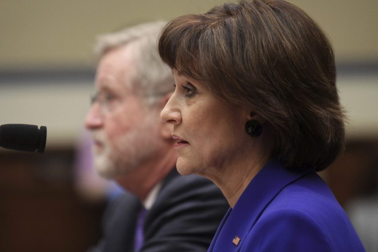 Former Internal Revenue Service official Lois Lerner, accompanied by her attorney is seen on Capitol Hill in Washington, Wednesday, March 5, 2014, during the House Oversight and Government Reform Committee hearing on the the agency's targeting of tea party groups, where she invoked her constitutional right not to incriminate herself. (AP Photo/Lauren Victoria Burke)