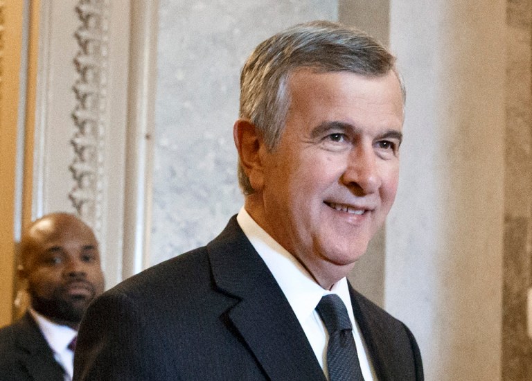 Sen. Mike Johanns, R-Neb., makes his way through the Capitol in Washington, Tuesday, Feb. 25, 2014. (AP Photo/J. Scott Applewhite)