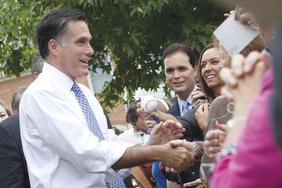 Republican Presidential candidate, Mitt Romney, greets supporters at the