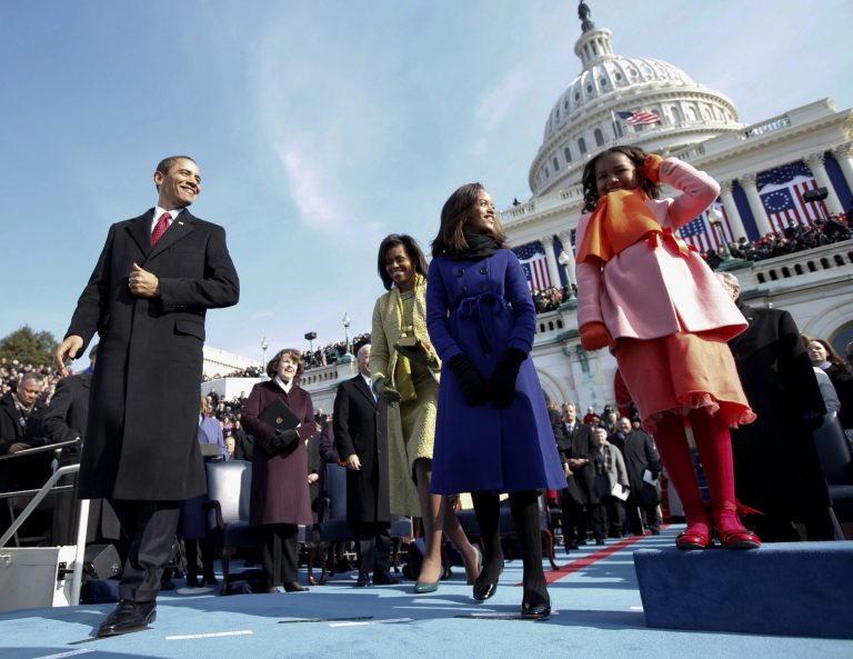 President-elect Barack Obama, left, and his wife Michelle and daughters Sasha, right and Malia, are seen on the podium moments before Obama was sworn in as the 44th president at the U.S. Capitol in Washington, Tuesday, Jan. 20, 2009. (AP Photo/Chuck Kennedy, Pool)