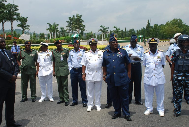 Nigeria's chief of defense staff Air Marshal Alex S. Badeh, front, and other army chiefs wait to address the Nigerians Against Terrorism group during a demonstration calling on the government to rescue the kidnapped girls of the government secondary school in Chibok, in Abuja, Nigeria, Monday, May 26, 2014. Scores of protesters chanting 