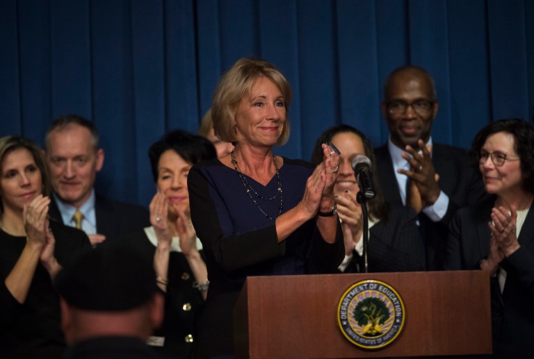 DeVos' remarks drew applause when she re-affirmed the department's 