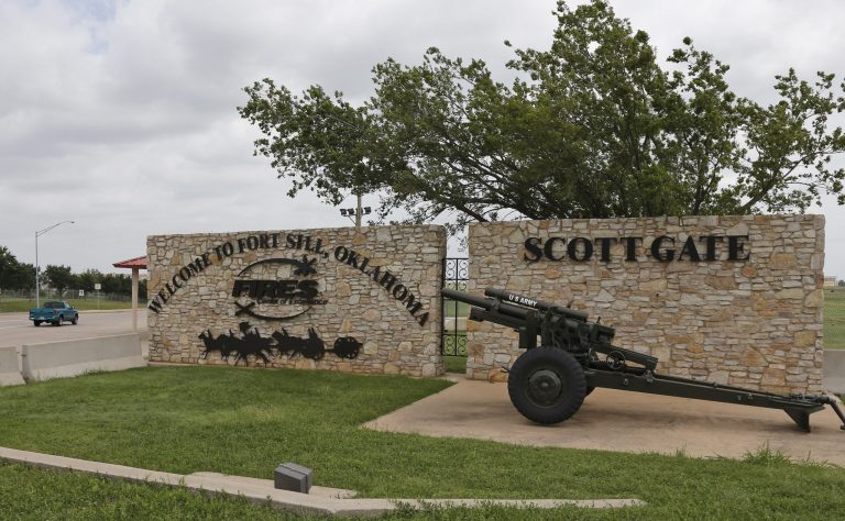 A sign is pictured at Scott Gate, one of the entrances to Fort Sill, in Fort Sill, Okla., Tuesday, June 17, 2014. (AP Photo/Sue Ogrocki)