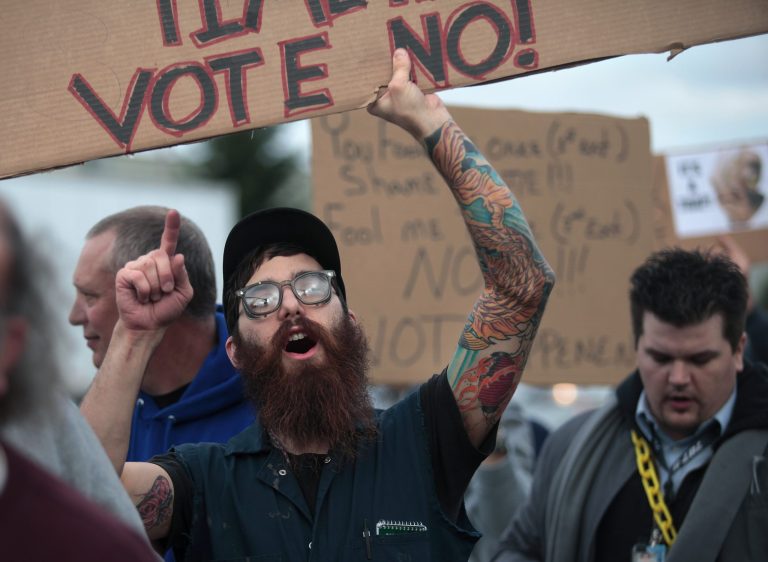 Jared Kalinski urges his fellow International Association of Machinists District 751 union members to vote no on Boeing's contract offer, in Everett, Wash., on Nov. 13. (AP Photo/The Herald, Mark Mulligan)