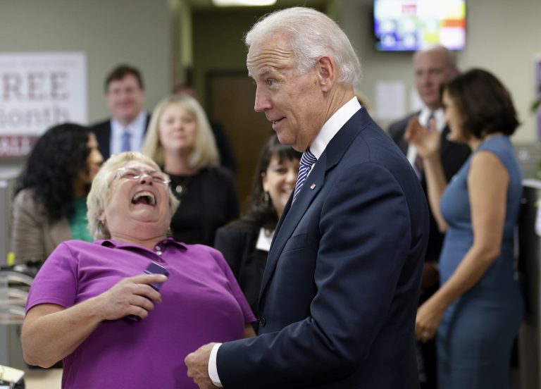 Vice President Joe Biden jokes with advocates as he visits the headquarters of the National Domestic Violence Hotline in West Lake Hills, Texas, Wednesday, Oct. 30, 2013, to help commemorate National Domestic Violence Awareness Months. (AP Photo/Eric Gay)