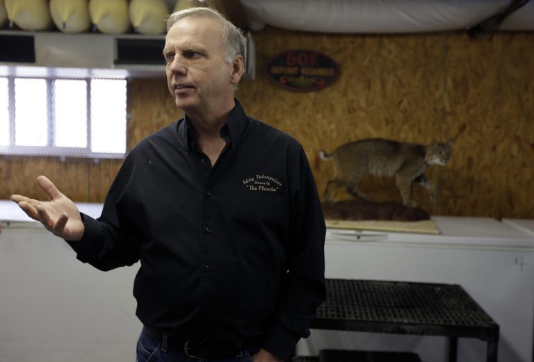 In this photo made Feb. 12, 2013, Anthony Eddy talks about the freeze-drying process in his studio in Slater, Mo. Animal lovers from across the country call on Eddy and his team to faithfully preserve their beloved departed pets for posterity through a freeze-drying process that can take up to a year before they are painstakingly preserved and returned to their owners. (AP Photo/Jeff Roberson)