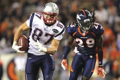 DENVER, CO-DECEMBER 18: Tight end Rob Gronkowski#87 of the New England Patriots makes a reception and eludes Jonathan Wilhite#29 of the Denver Broncos at Sports Authority Field at Mile High on December 18, 2011 in Denver, Colorado. The Patriots defeated the Broncos 41-23.(Photo by Doug Pensinger/Getty Images)***Local Caption***Rob Gronkowski; Jonathan Wilhite