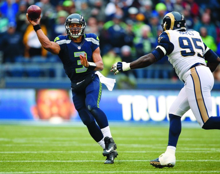 Kevin Casey/Getty Images
Seahawks quarterback Russell Wilson tied an NFL rookie record with 26 touchdown passes this season and finished with 3,118 yards passing and 489 yards rushing.