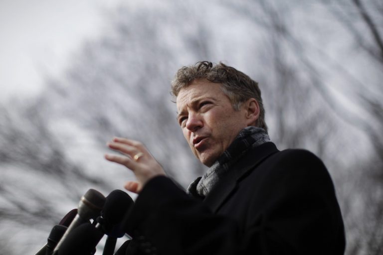 Sen. Rand Paul, R-Ky., announces his intention to sue the administration over the NSA's surveillance activities, in front of a federal court building in Washington on Wednesday. (AP Photo/Charles Dharapak)