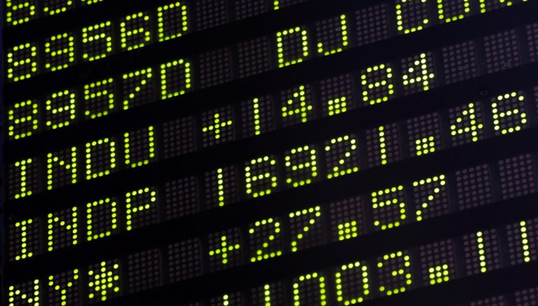 In this Thursday, June 19, 2014 photo, a board above the trading floor at the New York Stock Exchange shows that day's closing number for the Dow Jones Industrial Average, 16921.46, in New York. After treading water for most of March and April, stocks are nudging deeper into record territory and are closing in on milestones with big zeros attached to them.