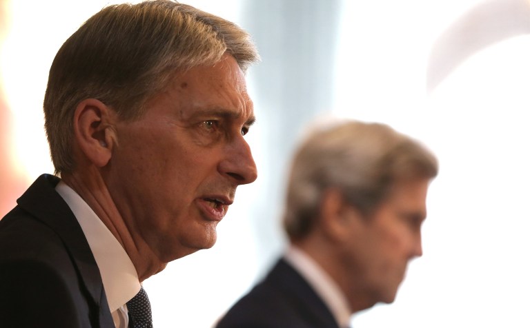 British Foreign Secretary Philip Hammond and U.S. Secretary of State John Kerry gave strong indications Monday that the U.K.'s decision to leave the European Union is real and won't be reversed. (Daniel Leal-Olivas/Pool photo via AP)